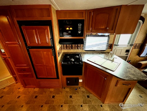 2010 Keystone Cougar X-Lite 27RLS RV Photo 3